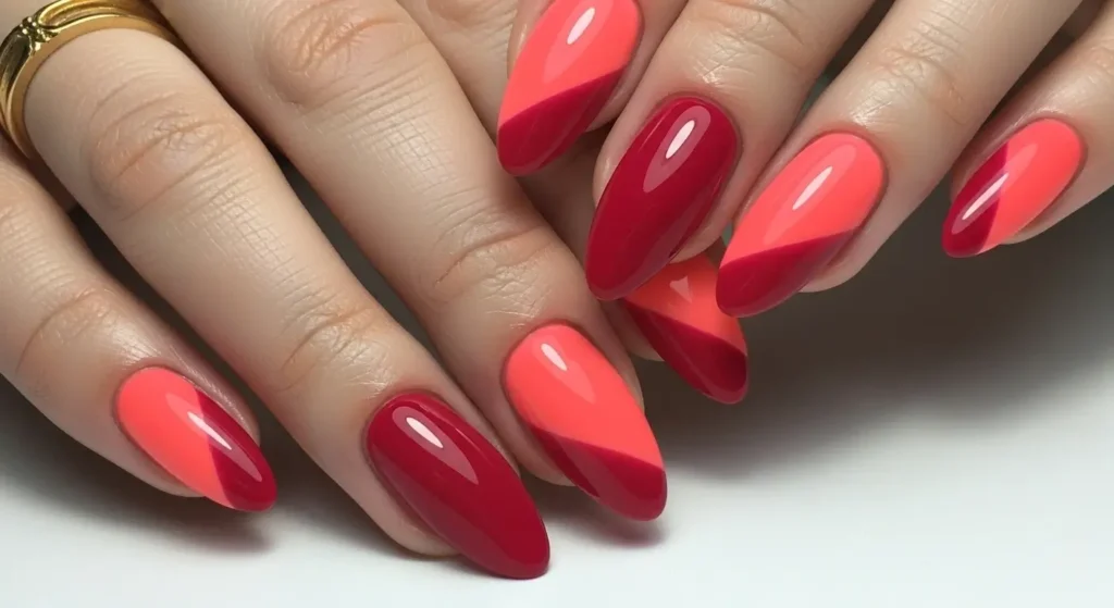 Trending Red Nail Designs for Summer 2025: Bold, Bright & Beautiful 7 Crimson and coral color block nails — vibrant geometric summer design.